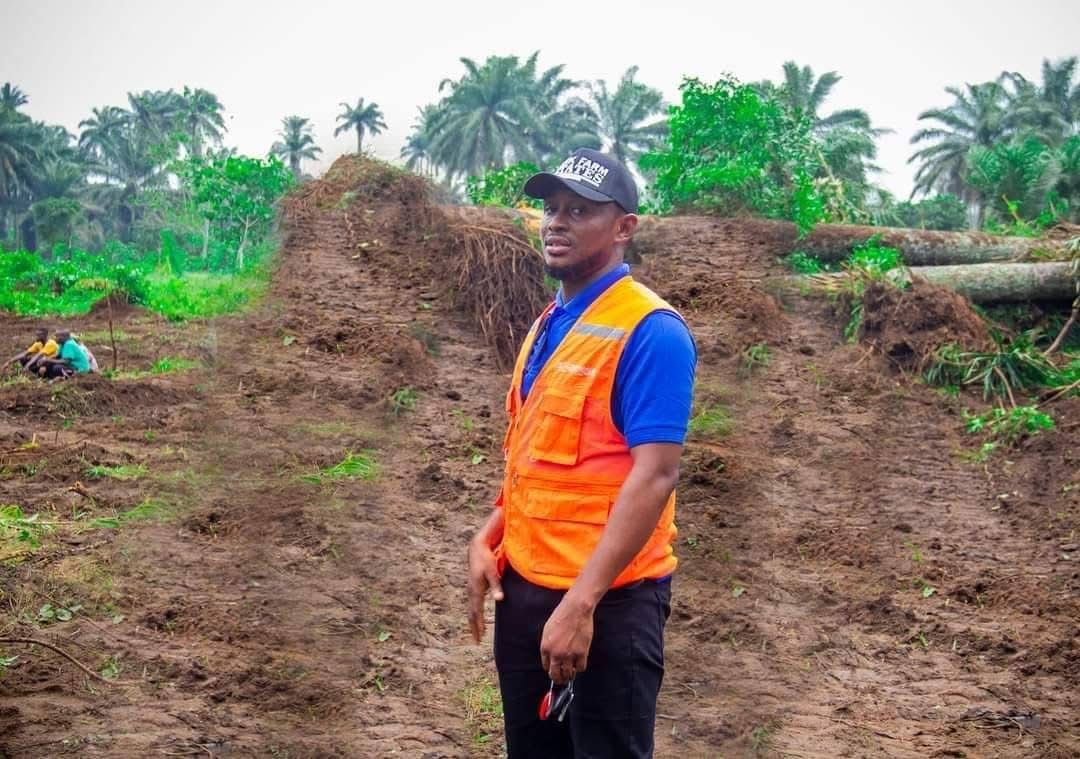 A Sunik team member on newly cleared land at the estate